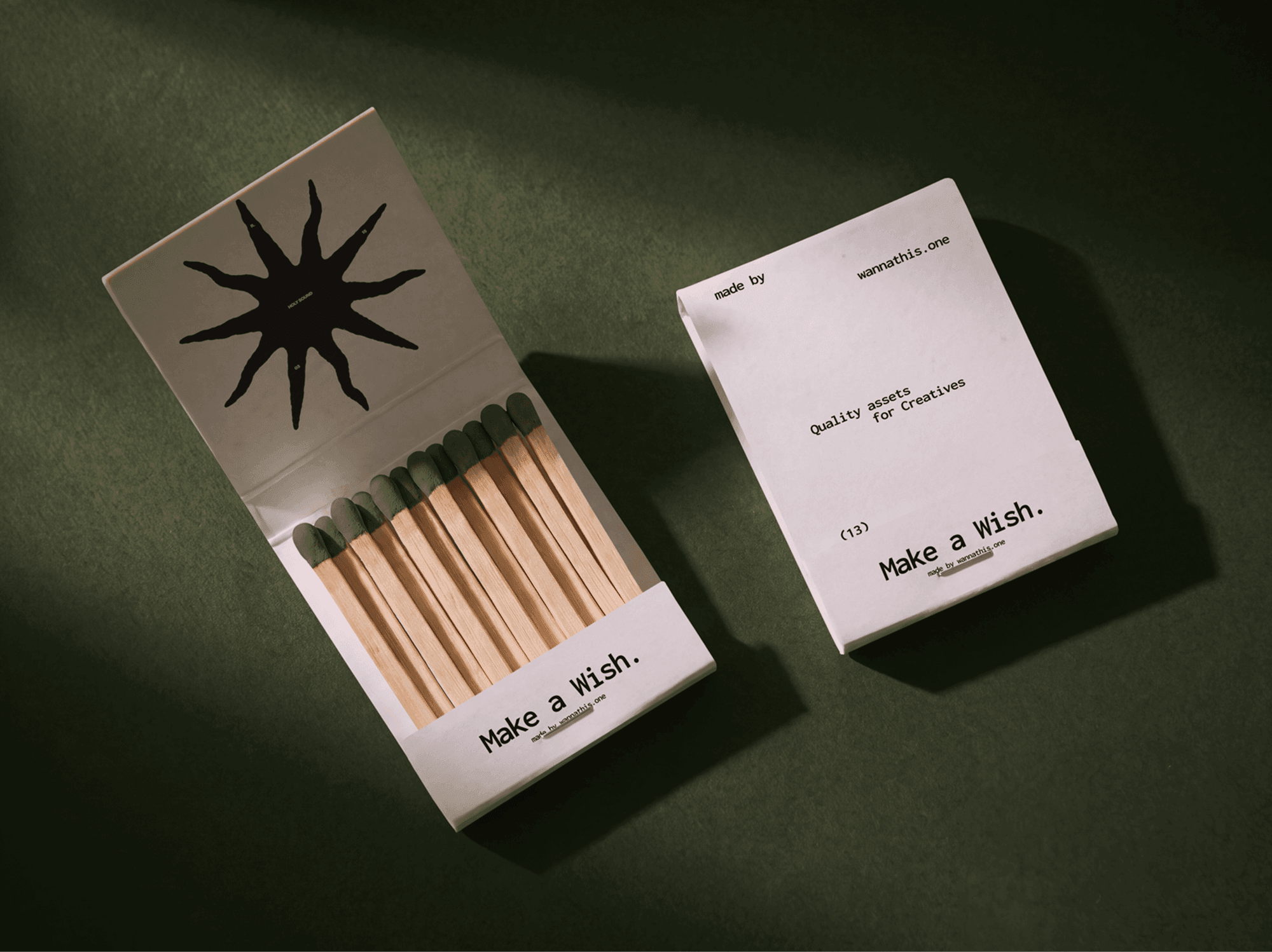 Two vintage matchboxes side by side, one open with matches and one closed