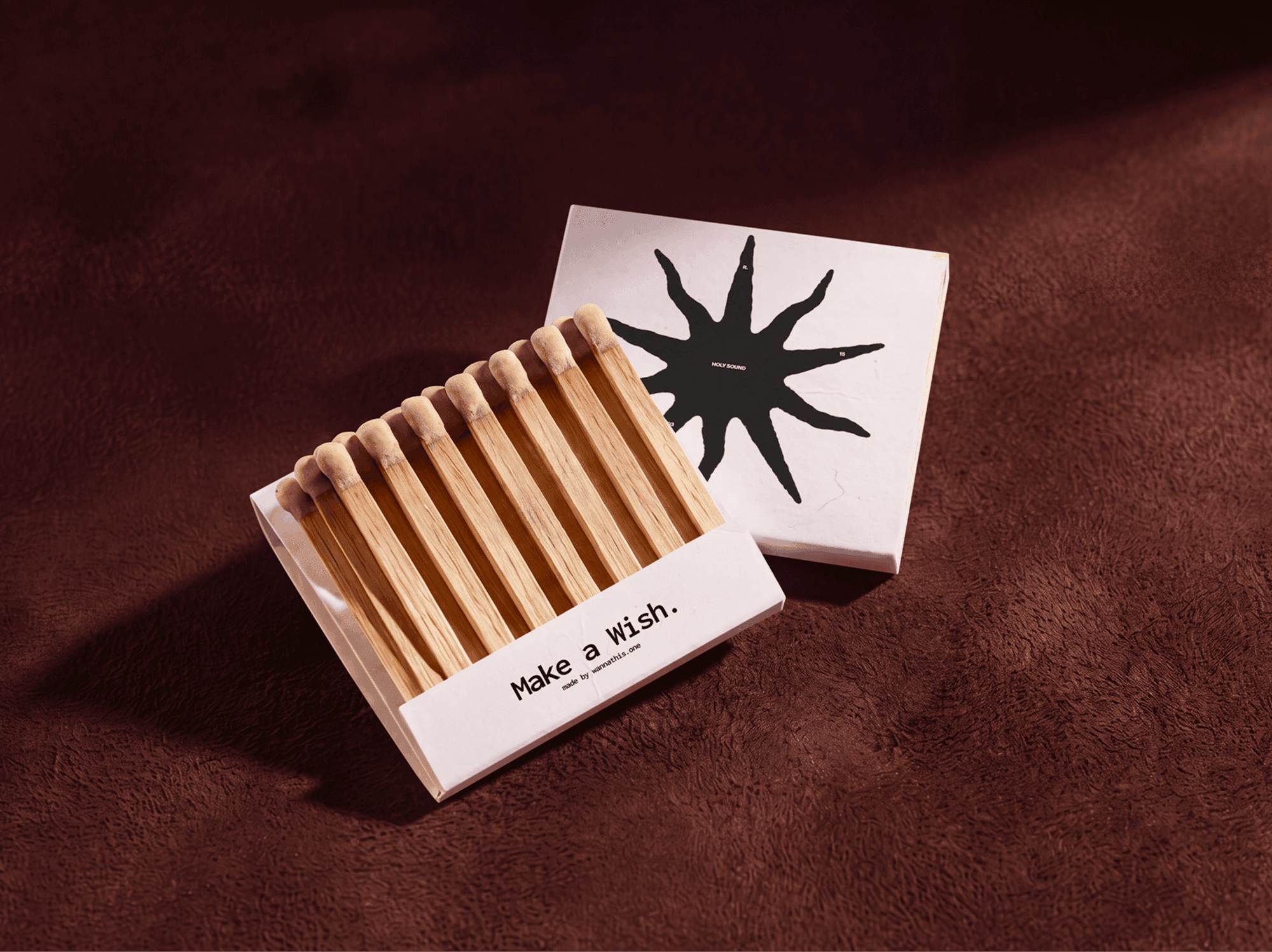 Vintage matchbox tray full of matches lying beside its separated outer sleeve