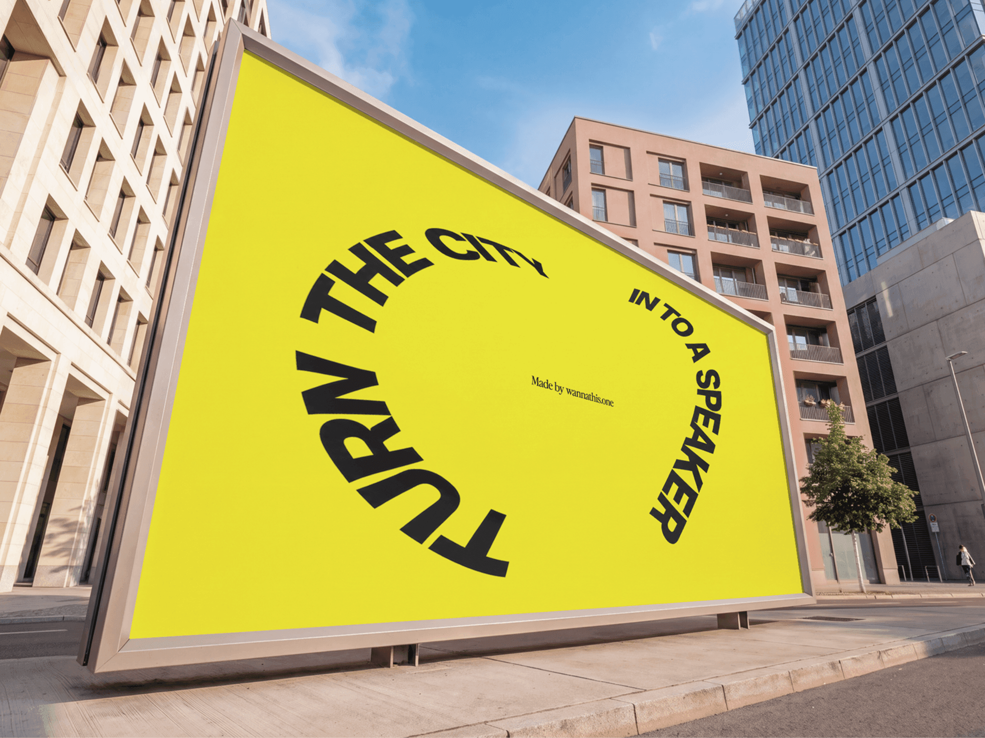 Street billboard standing beside a row of glass office blocks in daylight