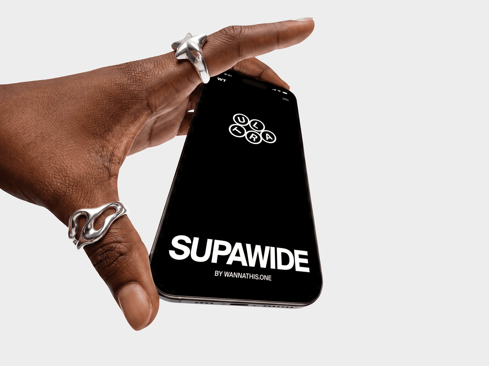 Two fingers pinching an iPhone mockup at the edge in a tight studio crop