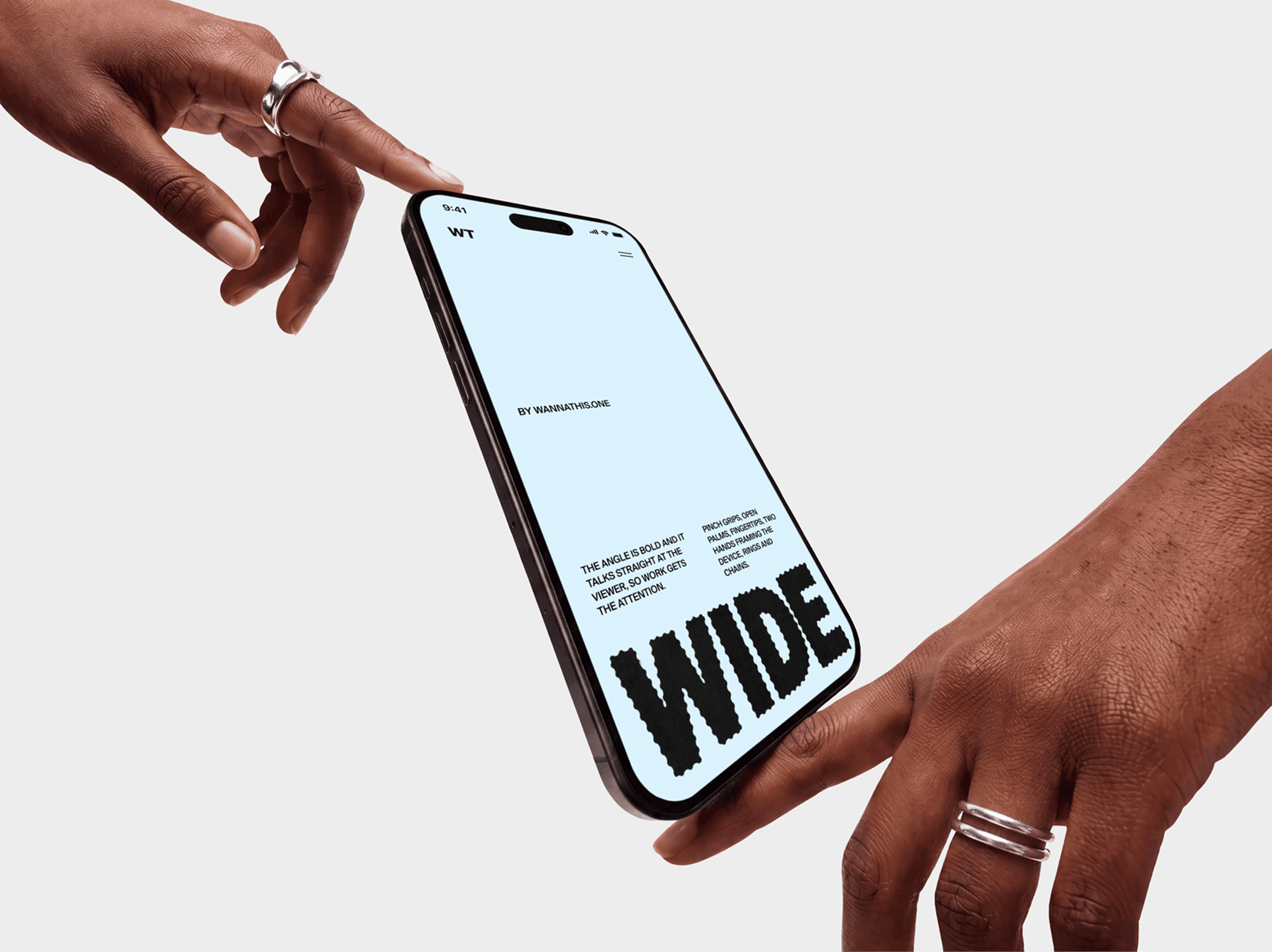 Gap between two open hands with an iPhone mockup suspended and untouched