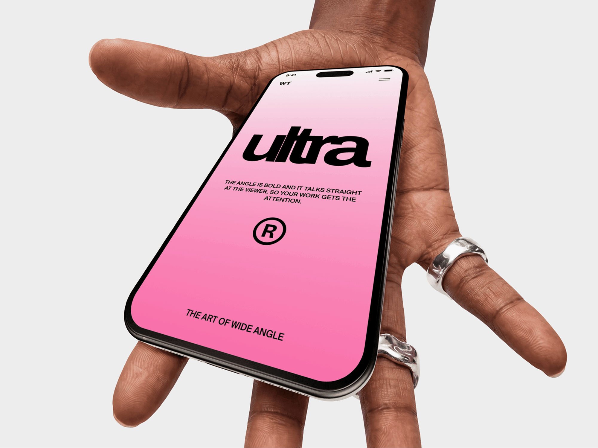 iPhone mockup lying across open fingers seen from above with the thumb out wide