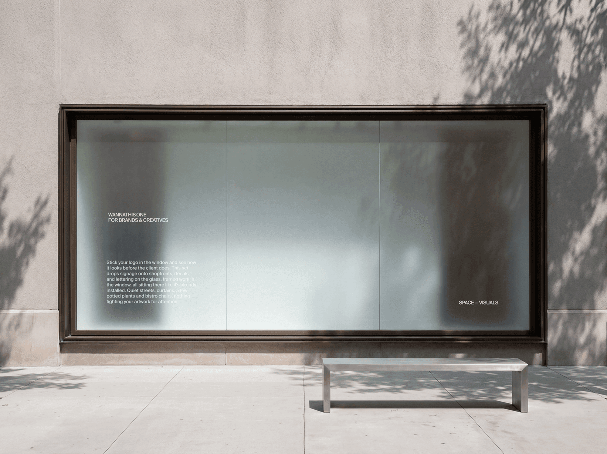 Wide retail window signage mockup on a refined modern retail building facade in a clean urban scene