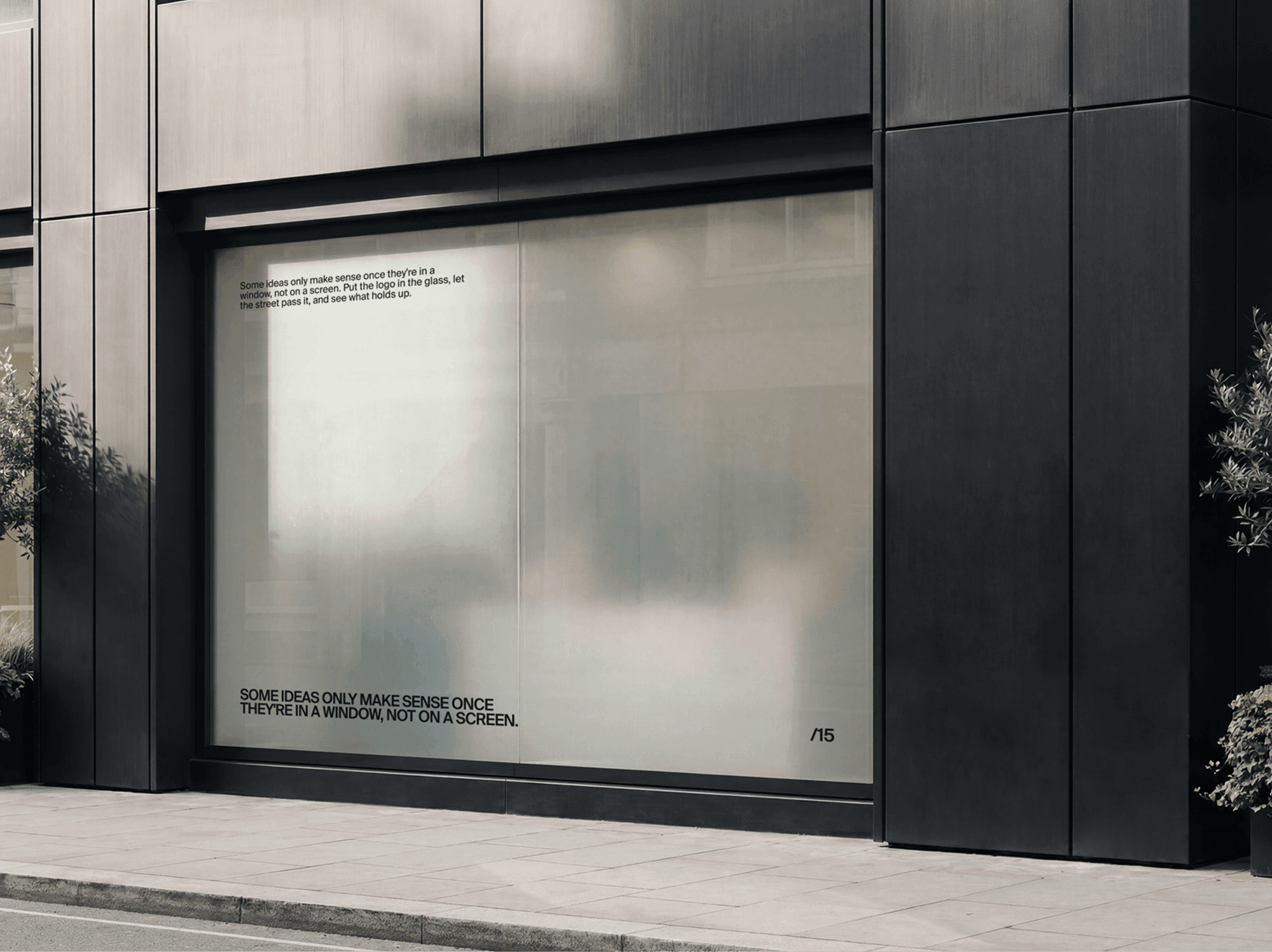 Minimal shop window display mockup on a refined modern building facade in a clean urban lifestyle scene