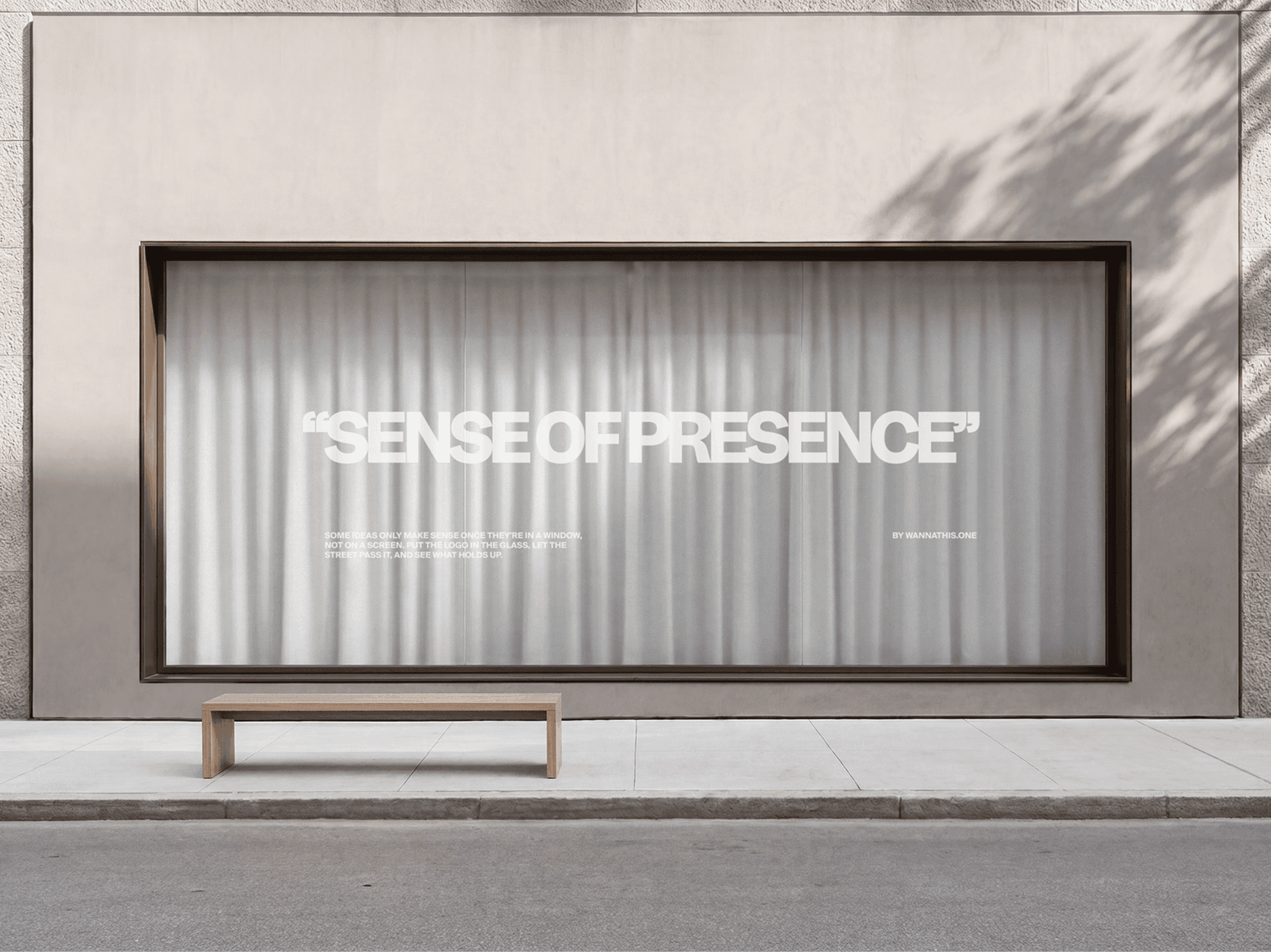 Large storefront window branding mockup with an outdoor bench placed in front in a refined retail scene