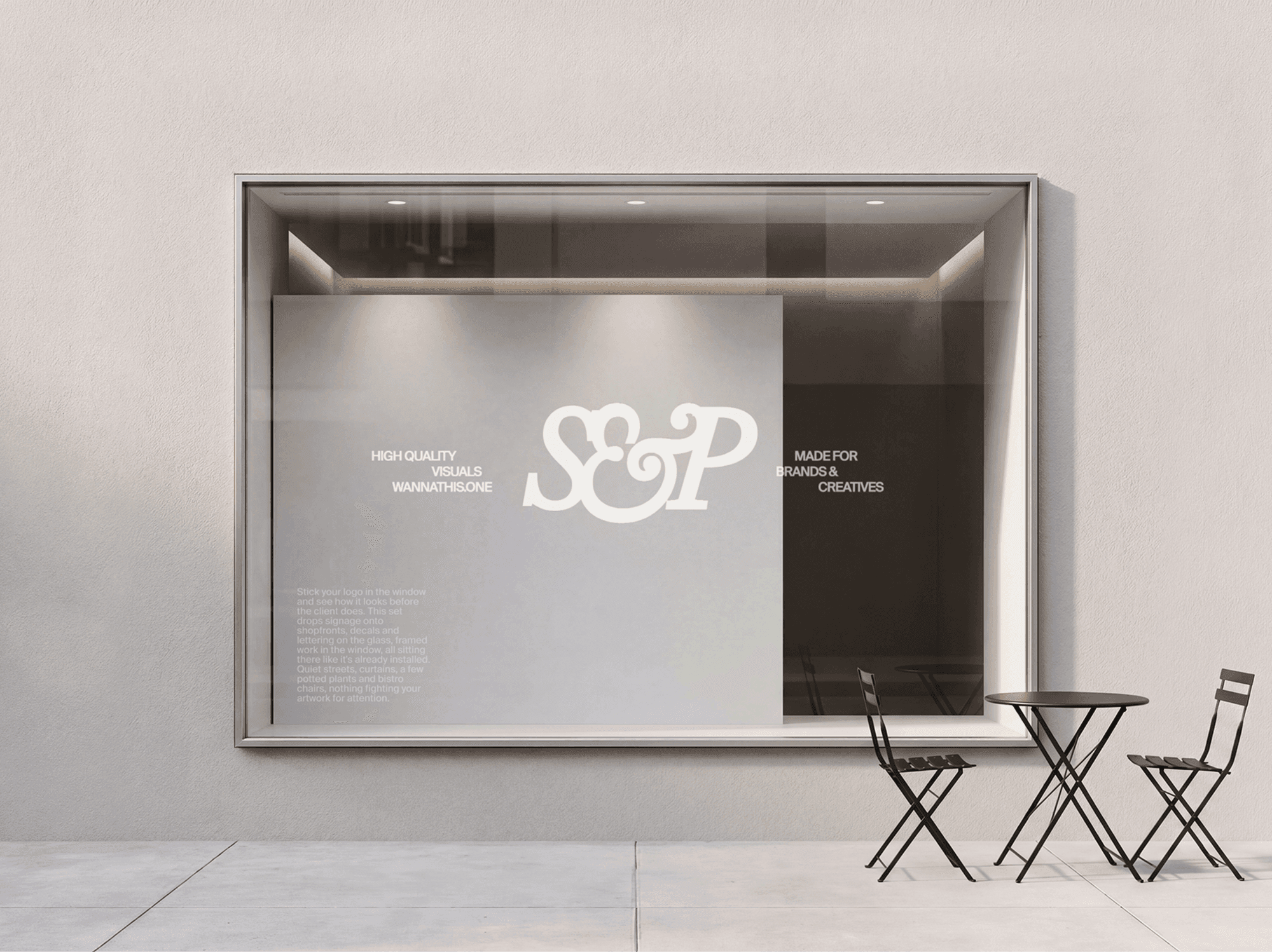 Square storefront window signage mockup with refined outdoor seating in a clean modern retail street scene